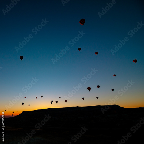 Hot air balloons. Silhouette of hot air balloons at sunrise in Cappadocia