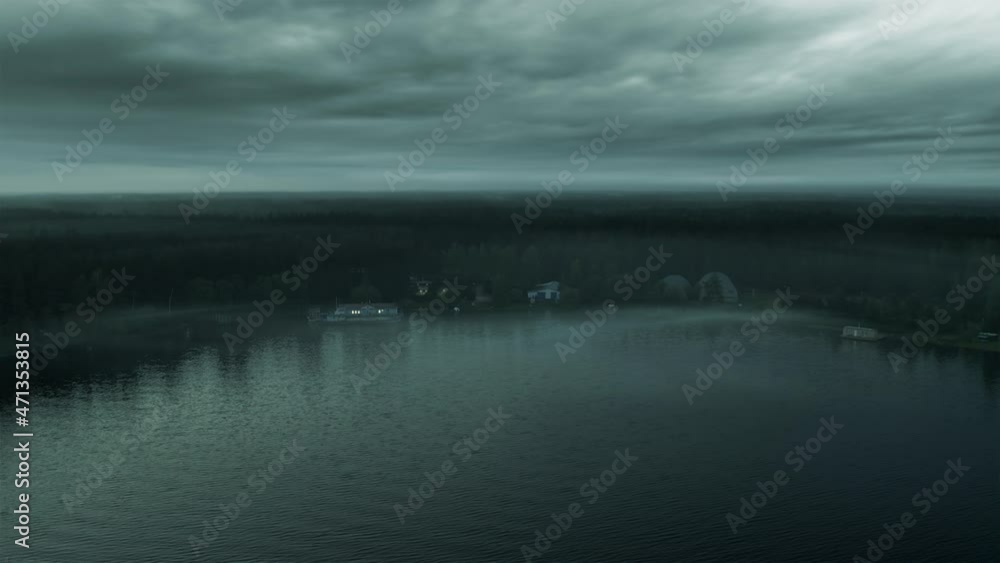 Old abandoned house on the lake in the evening at dusk Old abandoned house on the lake in the evening at dusk