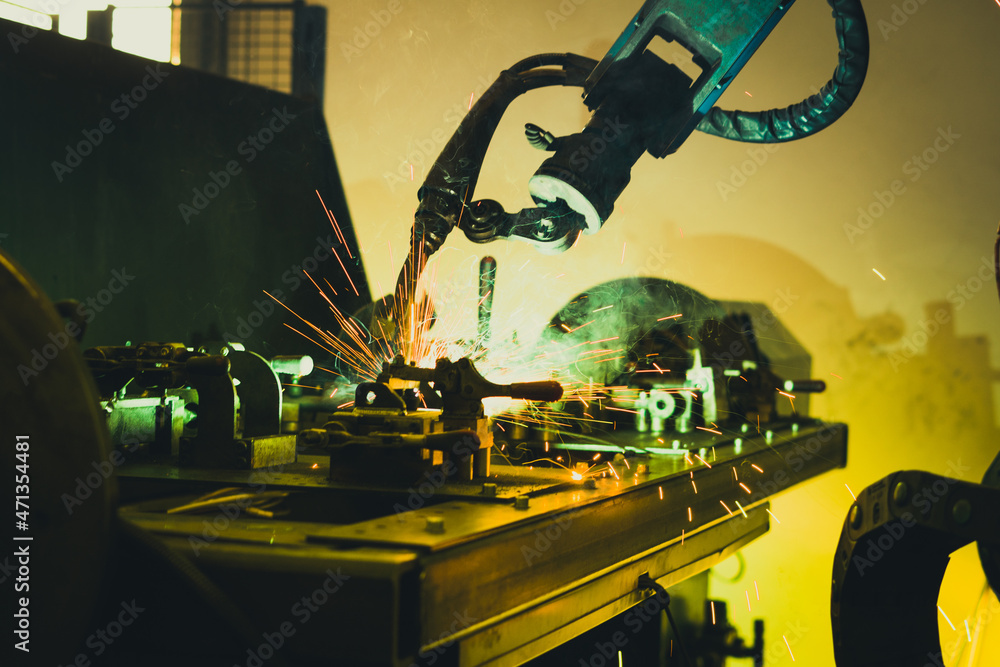 Robot welding a piece of steel.