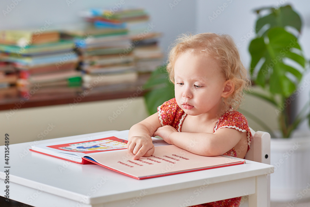 girl interested reading book home library. concept teaching children. Lifestyle girl interested reading book home library. concept teaching children. Lifestyle