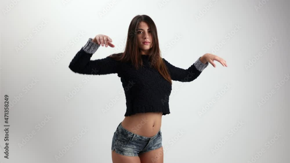 Woman posing and dancing in knitwear jumper Woman posing and dancing in knitwear jumper