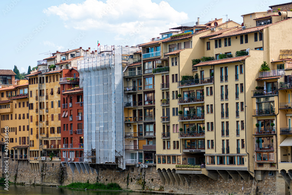 facades of traditional italian buildings by the river Arno, Florence, Italy