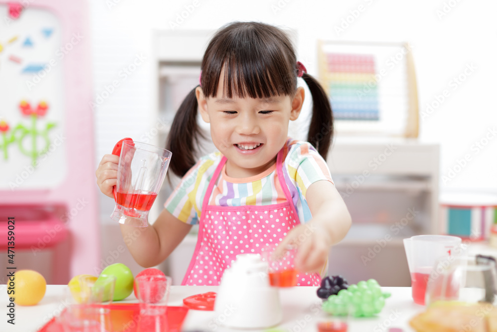 young girl pretend play food preparing at home young girl pretend play food preparing at home