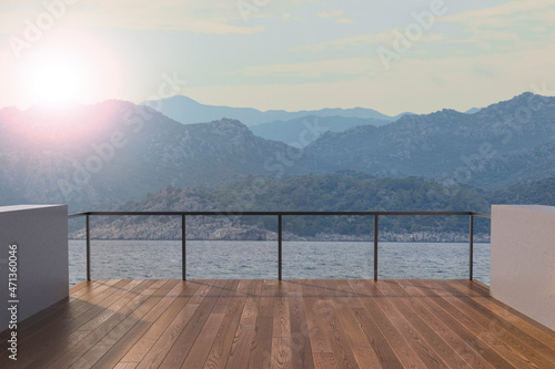 View from the balcony to the sea and mountains.Landscape. Sunny Day. Terrace with a beautiful view. Background with beautiful landscape. City near the sea. © nick_fedirko