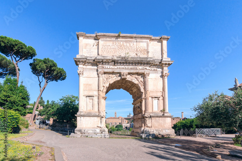 Arch of Titus located in the Roman Forum in Rome during a sunny day. No people photo
