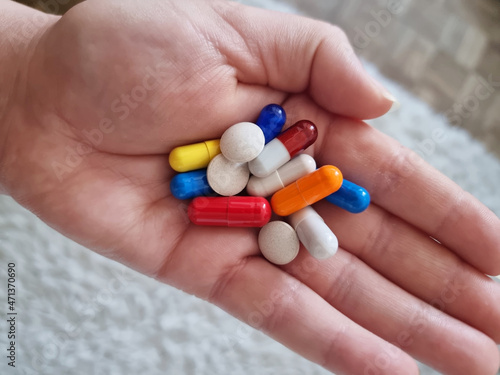 a handful of colored tablets