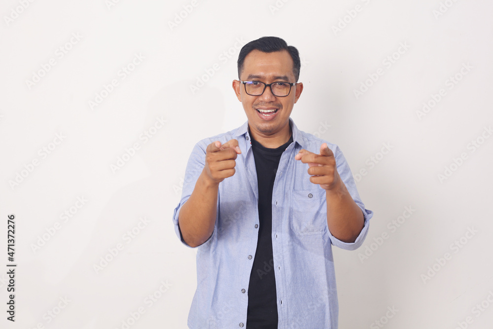 Lifestyle, travel and people concept. Portrait of enthusiastic handsome asian guy pointing fingers at camera and smiling, picking or recruiting to his team. Isolated on white background Lifestyle, travel and people concept. Portrait of enthusiastic handsome asian guy pointing fingers at camera and smiling, picking or recruiting to his team. Isolated on white background