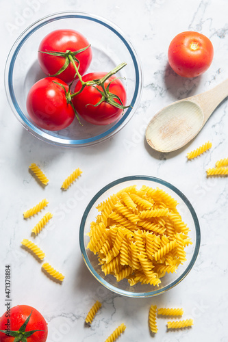 Fusilli pasta with tomato, black pepper and olive oil