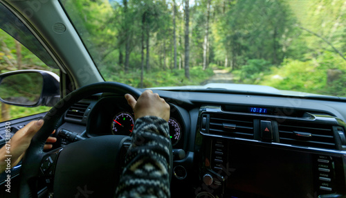 Driving off road car in the high altitude forest mountains photo