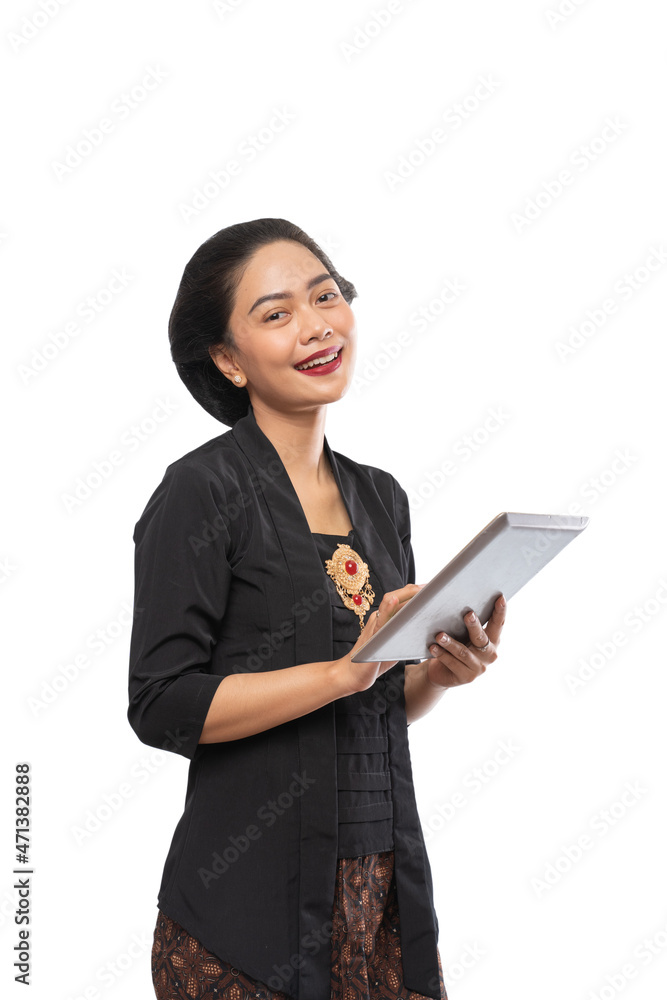 happy asian woman with kebaya using tablet phone happy asian woman with kebaya using tablet phone