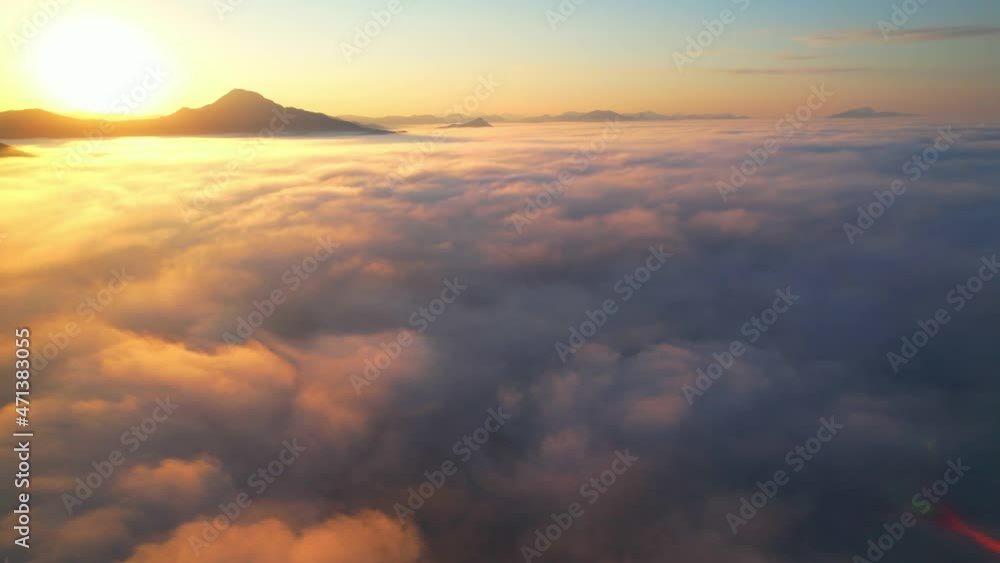4K Drone flight over the clouds during sunrise. Sun is rising above sea of clouds until the horizon, bright weather and amazing nature landscape
4K Drone flight over the clouds during sunrise. Sun is rising above sea of clouds until the horizon, bright weather and amazing nature landscape