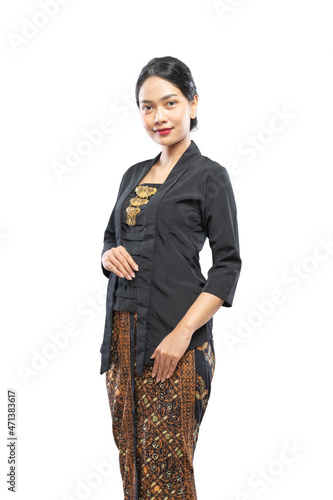 Indonesian woman with beautiful face wearing Kebaya standing looking at camera
