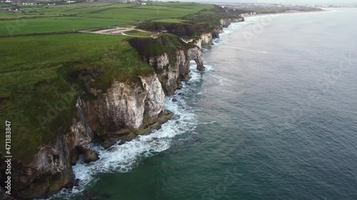 Aerial view of the rugged coastline looking towards Portrush with Magheracross Viewpoint in the foreground, County Antrim, Northern Ireland. photo