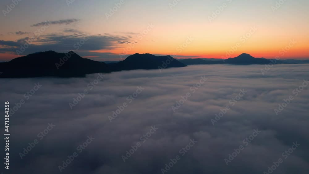 4K Drone flight over the clouds during sunrise. Sun is rising above sea of clouds until the horizon, bright weather and amazing nature landscape
4K Drone flight over the clouds during sunrise. Sun is rising above sea of clouds until the horizon, bright weather and amazing nature landscape