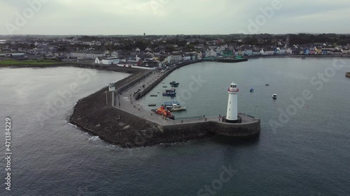 Aerial view of Donaghadee town on an overcast day, County Down, Northern Ireland. Moving towards the town from the harbour wall. photo