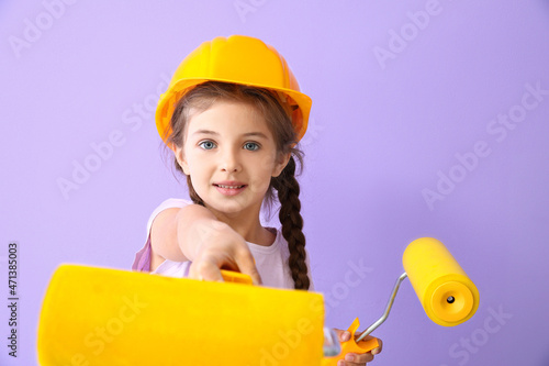 Cute little girl with paint...