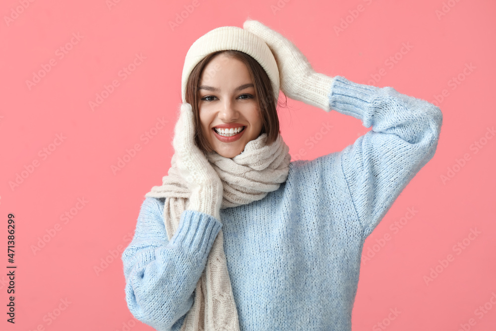 Young woman in stylish winter clothes on color background Young woman in stylish winter clothes on color background