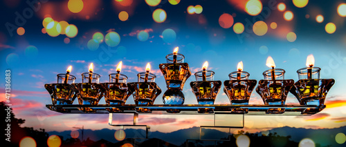 Image depicts Jewish holiday of light – Hanukkah, blurred backgrounds of moun...