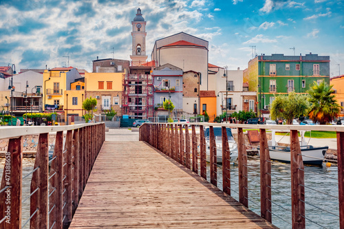 Attractive building on the shore of Lesina lake. Wonderful summer cityscape of Lesina town, Italy, Europe. Traveling concept background. photo