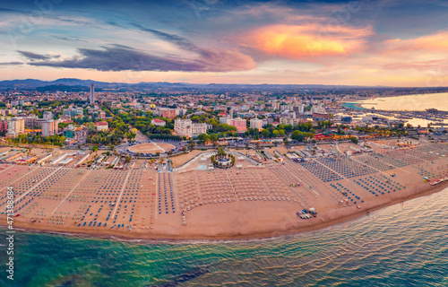 Impressive summer view from flying drone of Libera Rimini public beach. Wonderful summer scene of Italy, Europe. Superb evening view of Adriatic coast. Traveling concept background. photo