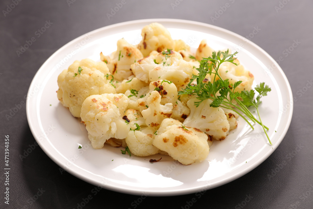 grilled cauliflower and parsley in plate grilled cauliflower and parsley in plate