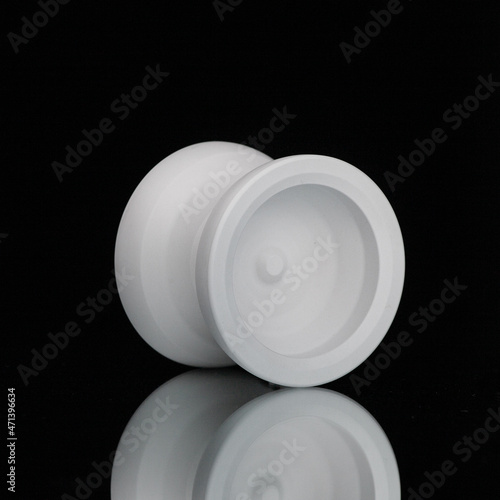 white yoyo on dark background