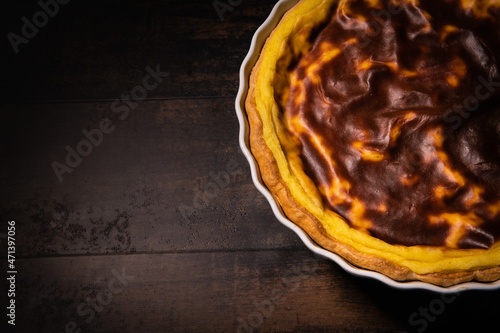 Parisian Flan, cutted classic tart served on a plate copy space photo