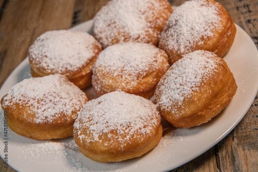 Freshly cooked Apricot jam doughnuts, referred to as jelly doughnuts, donuts in the US Freshly cooked Apricot jam doughnuts, referred to as jelly doughnuts, donuts in the US