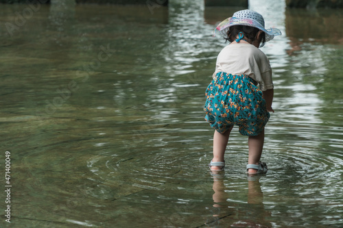 Girls playing with water in Huanglongxi scenic spot