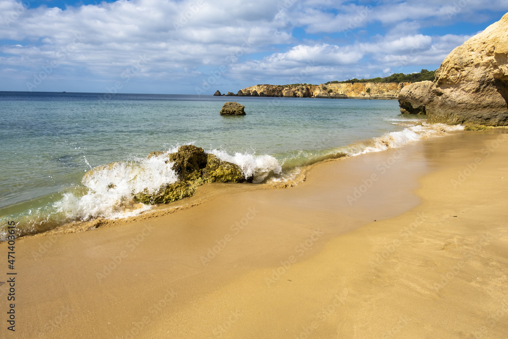 Scenic golden cliffs in the Praia do Vau beach in Portimao, Algarve, Portugal	
