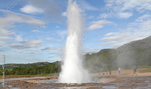 Geysir, Iceland - July 28, 2021: Geyser Strokkur in iceland errupting with hot water and steam, each year many tourists visit the geyser located in the golden circle