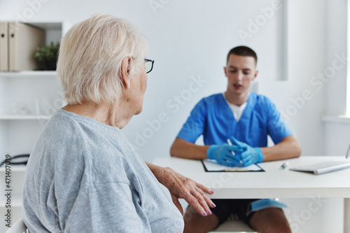 elderly woman at the doctor s and nurse s appointments health care