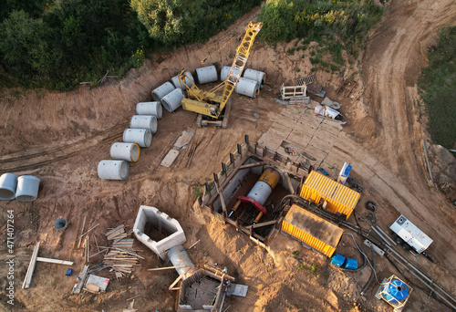 Concrete sewer pipes for laying external sewage system at construction site. Tunnel boring machine in storm sewer collector for underground construction of sewers, pipe, drainage systems.