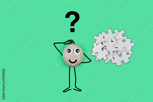 Animated character from a pebble with a happy face thinking through a solution to a problem in his mind