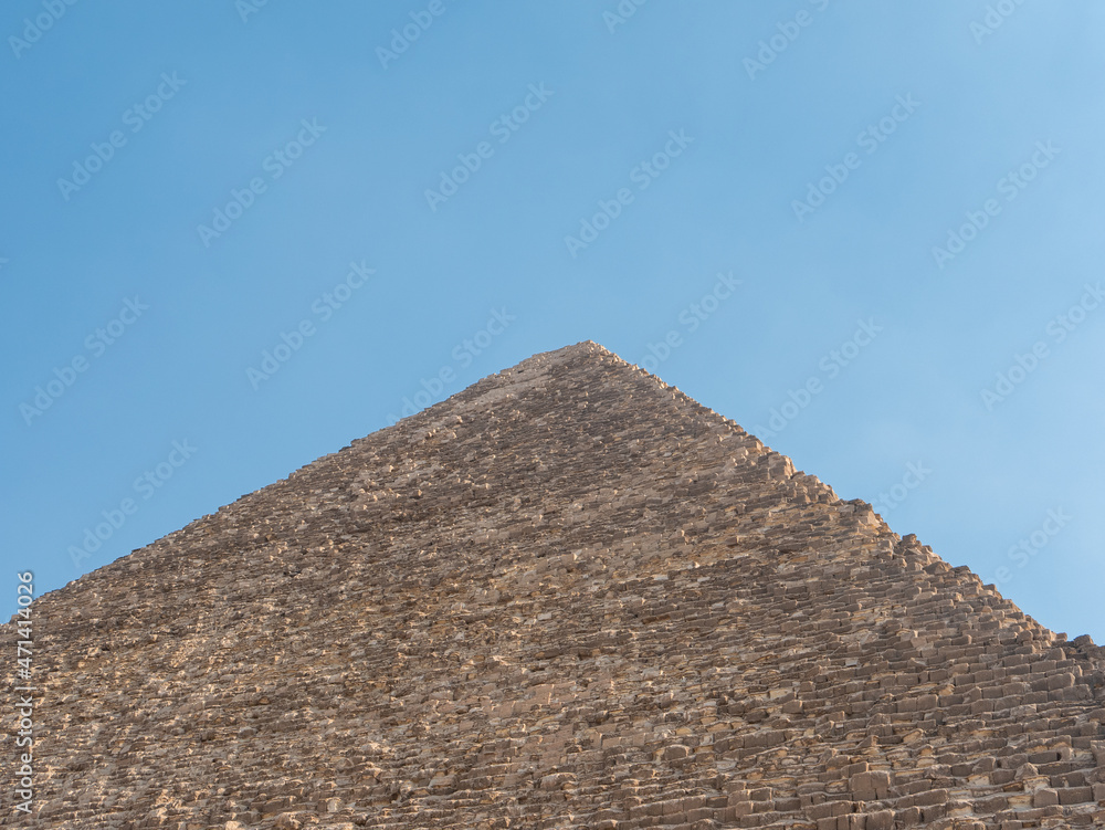 Pyramid of Cheops, a monument of the architectural art of Ancient Egypt, 138 meters high. Copy space. Giza, Cairo, Egypt.