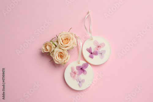 Flat lay composition with scented sachets on pink background