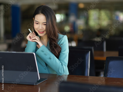 Business woman working with tablet touchpad computerใ