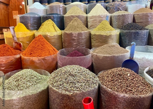 Spice shop in Sanliurfa in Turkey.  Colourful spices. Red pepper, ginger, turmeric, cumin photo