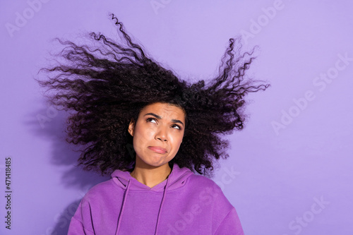 Portrait of minded hesitate lady look messy hairdress think thoughtful isolated on violet color background photo