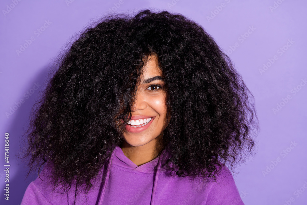 Portrait of adorable satisfied person hair cover one eye beaming smile look camera isolated on violet color background Portrait of adorable satisfied person hair cover one eye beaming smile look camera isolated on violet color background