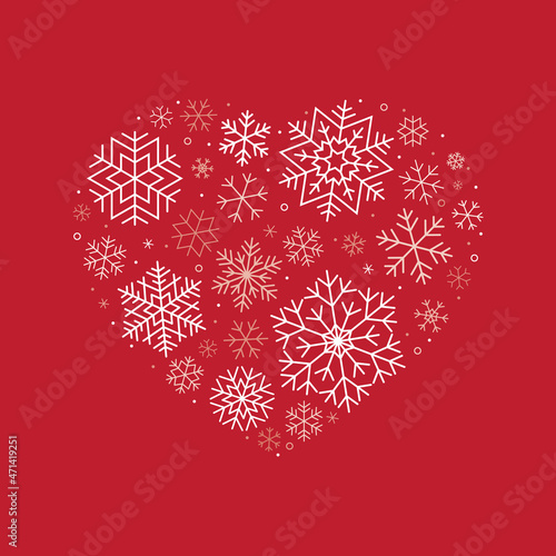 Red Christmas card with snowflakes forming a heart.