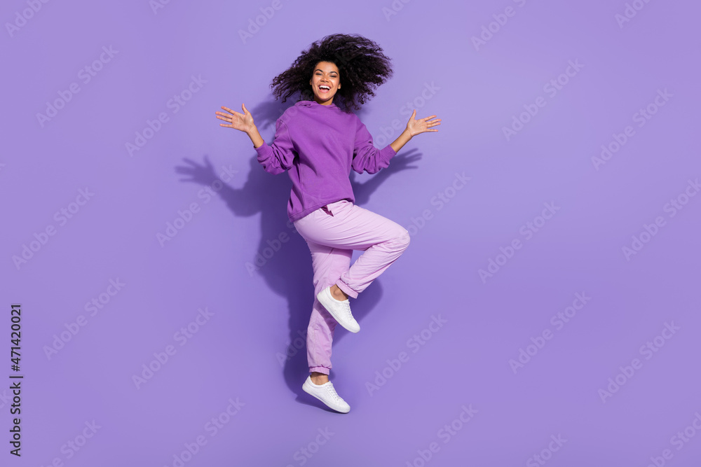 Full body portrait of attractive overjoyed wavy hairdo lady toothy smile enjoy free time isolated on violet color background