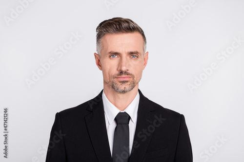 Photo of smart clever mature accountant dressed black suit isolated grey color background © deagreez