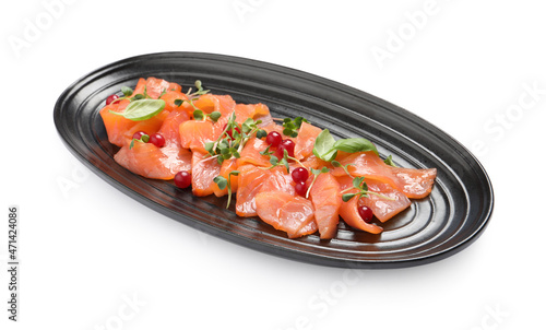 Delicious salmon carpaccio with herbs and red currants on white background