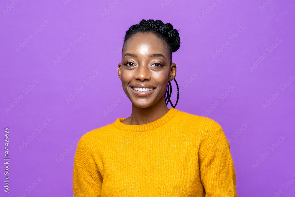 Casual African American woman smiling in purple studio isolated background Casual African American woman smiling in purple studio isolated background
