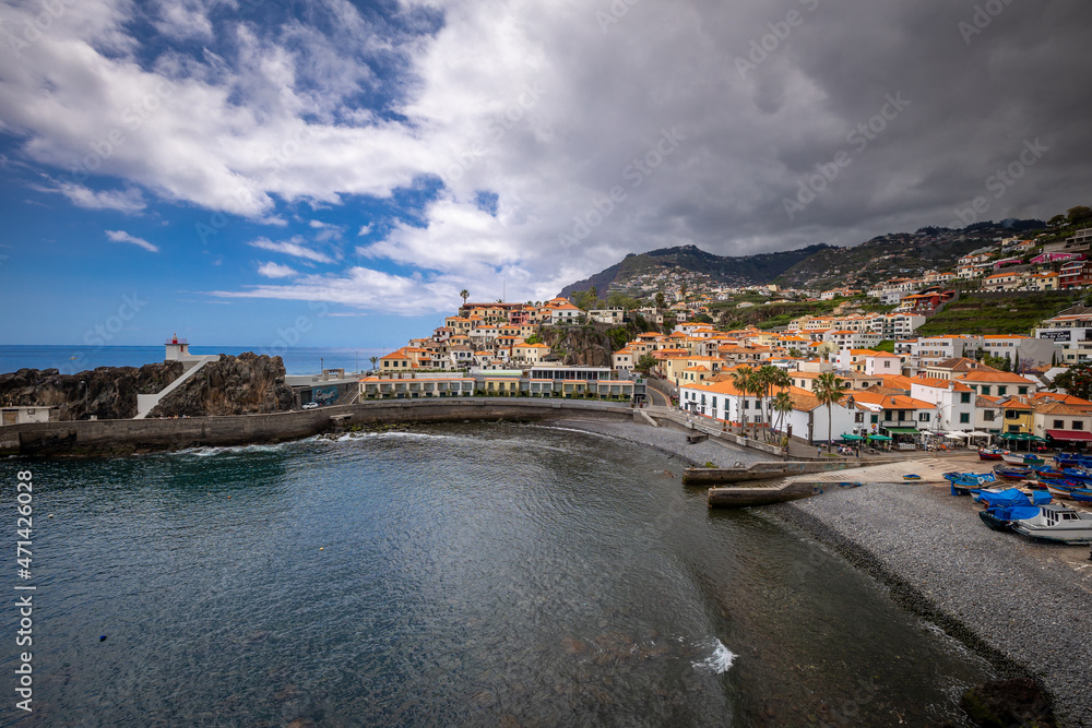 A small port with colorful boats in Madeira.