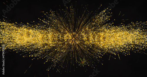 Fototapeta Image of new year's eve greetings and yellow fireworks exploding on black backgr