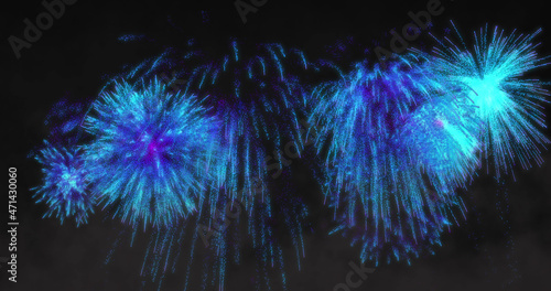 Image of blue fireworks exploding on black background