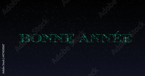 Image of happy new year greetings in shimmering green letters and fireworks
