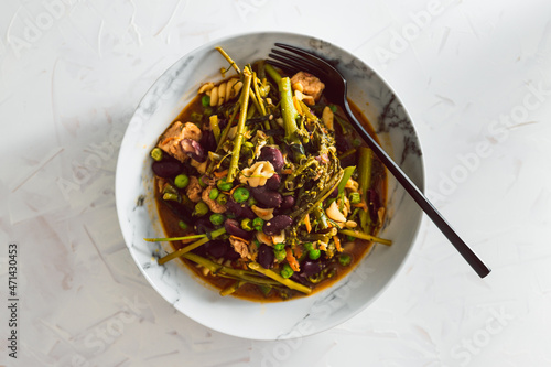 vegan stir fry with broccolini beans peas and mixed vegetables, healthy plant-based food photo